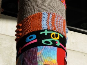 Ms Textual's gorgeous textured ochre and sky blue piece wrapped around a pole 